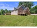 House with a wooden deck and a large backyard at 2120 Old Salisbury Concord Rd, Concord, NC 28025