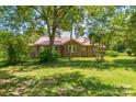 Brick house with red metal roof, side yard view at 2491 Highway 274 Hwy, Cherryville, NC 28021