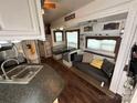 Cozy living room with sofa, table, and built-in seating at 332 Mount View Ln, New London, NC 28127