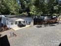 Exterior view showing the house and neighboring properties at 108 Meadowview Cir, New London, NC 28127