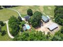 Aerial view of house, pool, and barns at 5610 Golden Pond Dr, Indian Trail, NC 28079