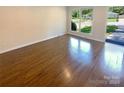 Bright living room with hardwood floors and large windows at 1913 Herrin Ave, Charlotte, NC 28205