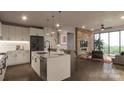 Modern kitchen with large island and stainless steel appliances at 9901 Benfield Rd # 314, Charlotte, NC 28269
