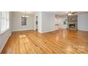 Dining room with hardwood floors and view into kitchen at 805 Rowan Avenue Ext, Spencer, NC 28159