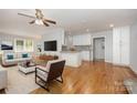 Living room with hardwood floors, open concept kitchen at 805 Rowan Avenue Ext, Spencer, NC 28159