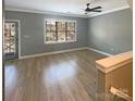 Spacious living room with hardwood floors and access to the front door at 210 Harbour Place Dr, Davidson, NC 28036