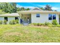 Newly renovated single story home with covered porch at 8433 Rittenhouse Cir, Charlotte, NC 28270