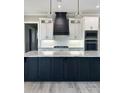 Elegant kitchen with a dark lower island, white upper cabinets, and a stunning quartz countertop at 0 Tidewater Rd, Salisbury, NC 28146