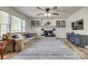 Living room with fireplace, built-in shelving and hardwood floors at 198 N Main St, Richburg, SC 29729