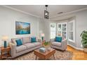 Virtually staged living room with bay window and comfortable seating at 1804 Robinwood Village Dr, Gastonia, NC 28054
