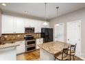 Kitchen with granite countertops, stainless steel appliances, and an island at 1804 Robinwood Village Dr, Gastonia, NC 28054