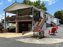House with large deck and red chairs at 231 Badin View Rd, New London, NC 28127