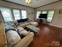 Spacious living room featuring a large sectional sofa and flat-screen TV at 231 Badin View Rd, New London, NC 28127