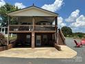 House with large deck and stairs at 231 Badin View Rd, New London, NC 28127