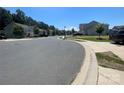 Quiet residential street with houses and green lawns at 127 Tranquil Ct # 18A, Locust, NC 28097
