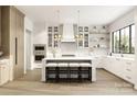 Spacious kitchen with white cabinets, large island, and stainless steel appliances at 337 Tradition Dr, Mount Gilead, NC 27306