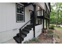 Black painted stairs leading to a deck and entrance at 310 Chaney St, Wingate, NC 28174