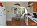 Bright kitchen featuring built-in shelving and a dining area at 121 College St, Chester, SC 29706