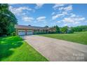 Ranch home with a large driveway and spacious yard at 1418 Oakwood Ave, Kannapolis, NC 28081