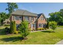 Two-story brick home with a lush green lawn at 2073 Hambridge Ave, Kannapolis, NC 28081