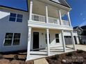 Front entrance with porch and balcony above at 2027 Cedar Falls Dr # 75, Waxhaw, NC 28173