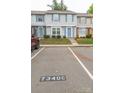 Parking lot in front of townhouses, with space number 7340C at 7340 Pebblestone Dr # C, Charlotte, NC 28212