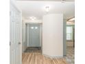 Light and airy entryway with light gray doors and wood flooring at 7340 Pebblestone Dr # C, Charlotte, NC 28212