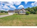 Ranch-style home with solar panels and a spacious yard at 1000 Creekside Dr, Lincolnton, NC 28092