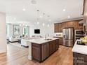 Modern kitchen with island and stainless steel appliances at 135 Armstrong Rd, Belmont, NC 28012