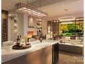 Modern kitchen with island, wine storage, and view to backyard at 409 Queens Rd # 403, Charlotte, NC 28207