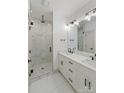 Elegant bathroom with double vanity, marble tile, and a large shower at 1529 Beckwith Pl, Charlotte, NC 28205