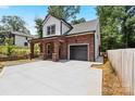 Brick two-story home with a gray door and attached garage at 4426 Pine St # 74, Kannapolis, NC 28081