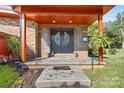 Brick front porch with double doors and decorative glass at 640 Davie Ave, Statesville, NC 28677