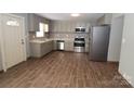 Modern kitchen featuring stainless steel appliances and tile flooring at 410 Clinton Dr, Kings Mountain, NC 28086