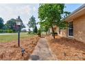 Sidewalk next to brick house with landscaping at 1401 N Post Rd, Shelby, NC 28150