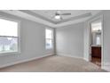 Spacious bedroom with neutral walls and ceiling fan at 9837 Jubilee Ct, Charlotte, NC 28215