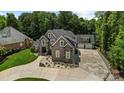 Aerial view of a luxurious home with a large driveway and surrounding trees at 531 Coman Ln, Kings Mountain, NC 28086