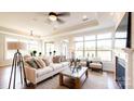 Spacious living room featuring a cozy fireplace and large windows at 132 Alenda Lux Cir # 7, Mooresville, NC 28115