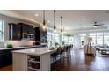 Modern kitchen with white quartz island and dark cabinetry at 132 Alenda Lux Cir # 7, Mooresville, NC 28115