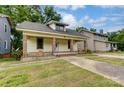 Nice yellow house with a front porch and brick accents at 430 Dave Lyle Blvd, Rock Hill, SC 29730
