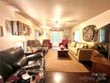 Spacious living room with ample seating and hardwood floors at 5419 Stevens Mill Rd, Matthews, NC 28104