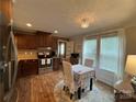 Modern kitchen with stainless steel appliances and wood flooring at 5401 Stevens Mill Rd, Matthews, NC 28104