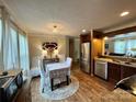 Eat-in kitchen with stainless steel appliances and wood flooring at 5401 Stevens Mill Rd, Matthews, NC 28104