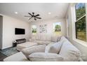 Spacious living room with a large sectional sofa and plenty of natural light at 2005 Germany Dr, Dallas, NC 28034