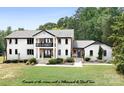 Two-story whitewashed house with black trim at 4299 Randleman Rd, Iron Station, NC 28080