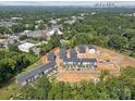 Aerial view of townhome community near city skyline at 1530 Levy Way, Charlotte, NC 28205