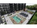 Aerial view of apartment building with rooftop pool, grilling area, and fire pit at 9901 Benfield Rd # 501, Charlotte, NC 28269