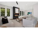 Spacious living room featuring a modern fireplace and ample natural light at 518 Ideal Way, Charlotte, NC 28203