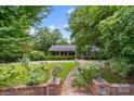 Brick ranch home with landscaped yard and walkway at 866 Concord Rd, Davidson, NC 28036