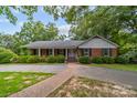 Brick ranch house with covered porch and brick walkway at 866 Concord Rd, Davidson, NC 28036